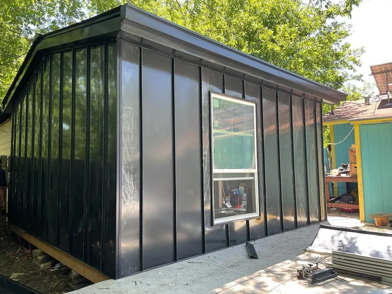 Black standing seam metal wall panels for Roof Inspection in Ellicott