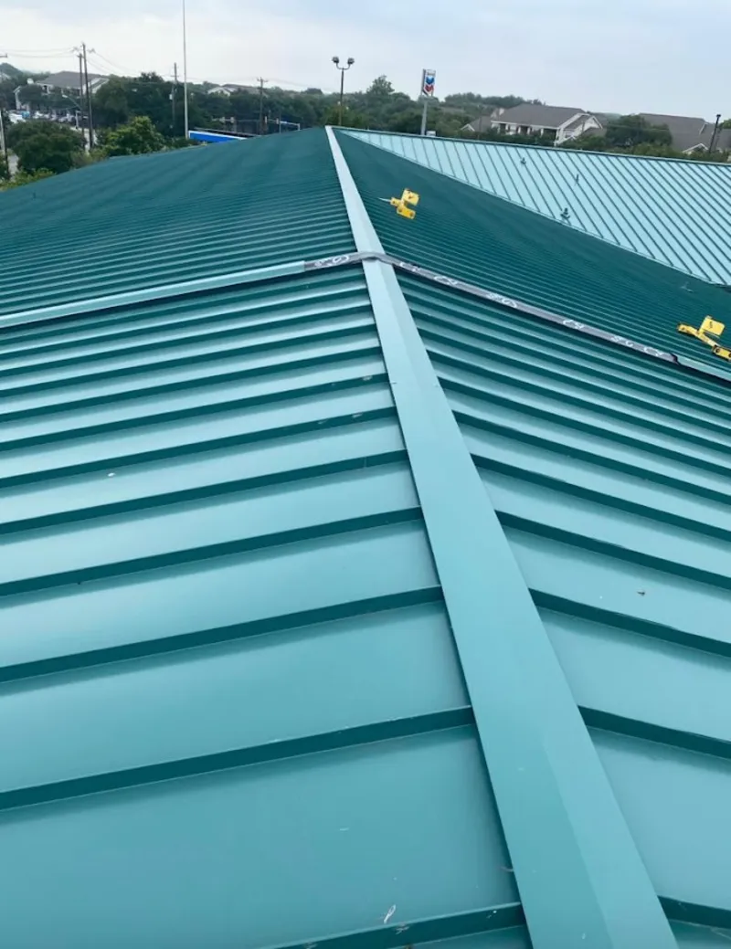 Green commercial metal roof ridge and valley for Metal Roof Repair in Ellicott